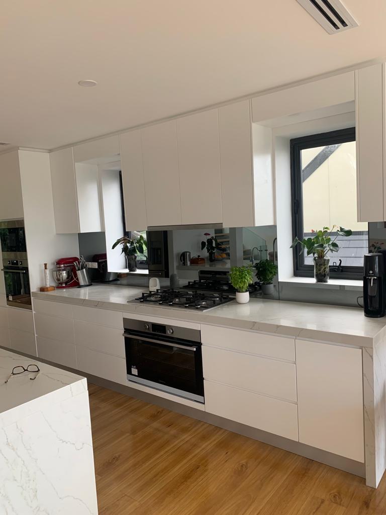 white kitchen with wooden floor