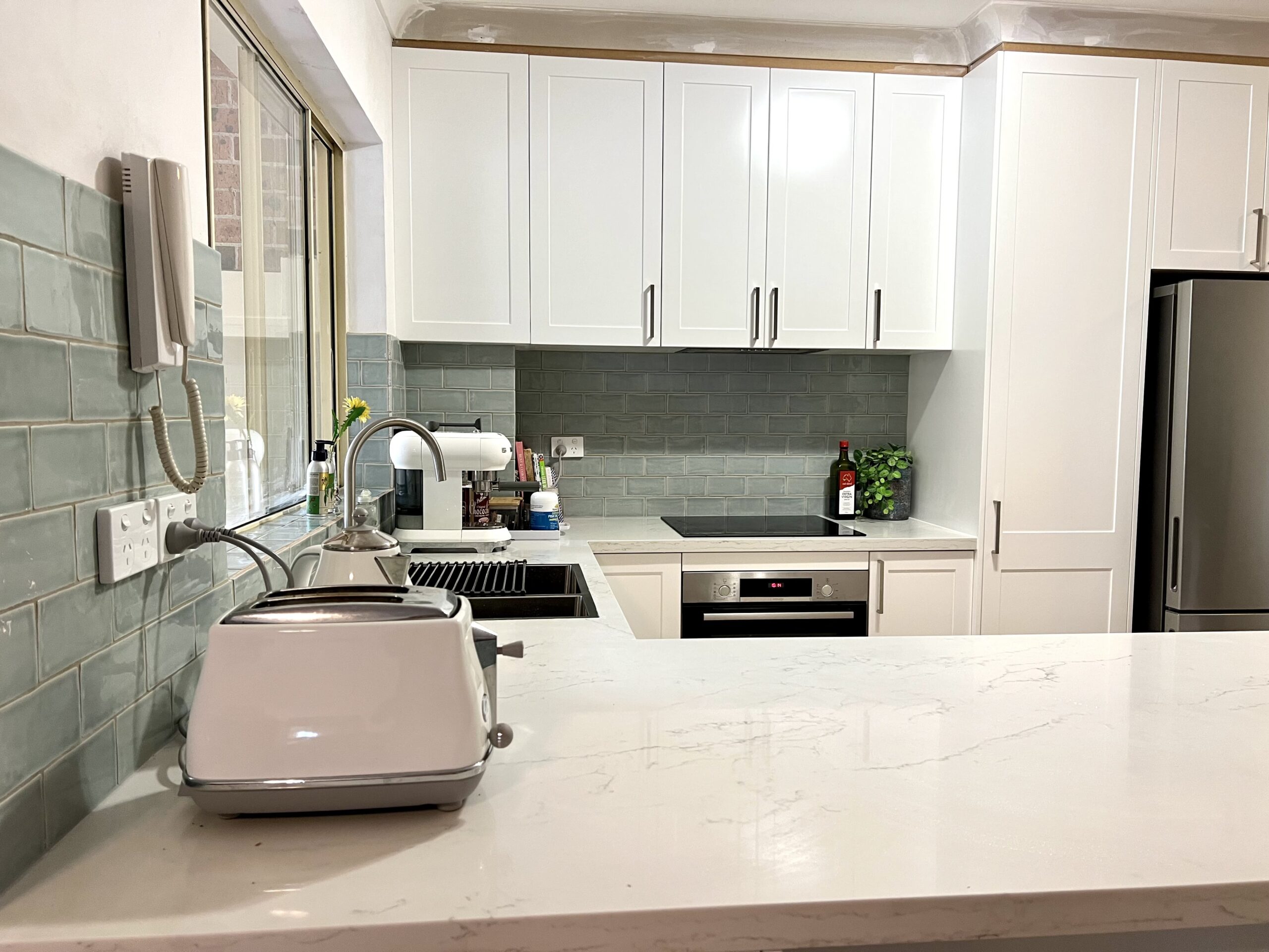 White Marble Benchtop Peninsula Kitchen(Side view)
